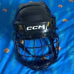 CCM Black Helmet with Yellow Vent Accents and Black Cage